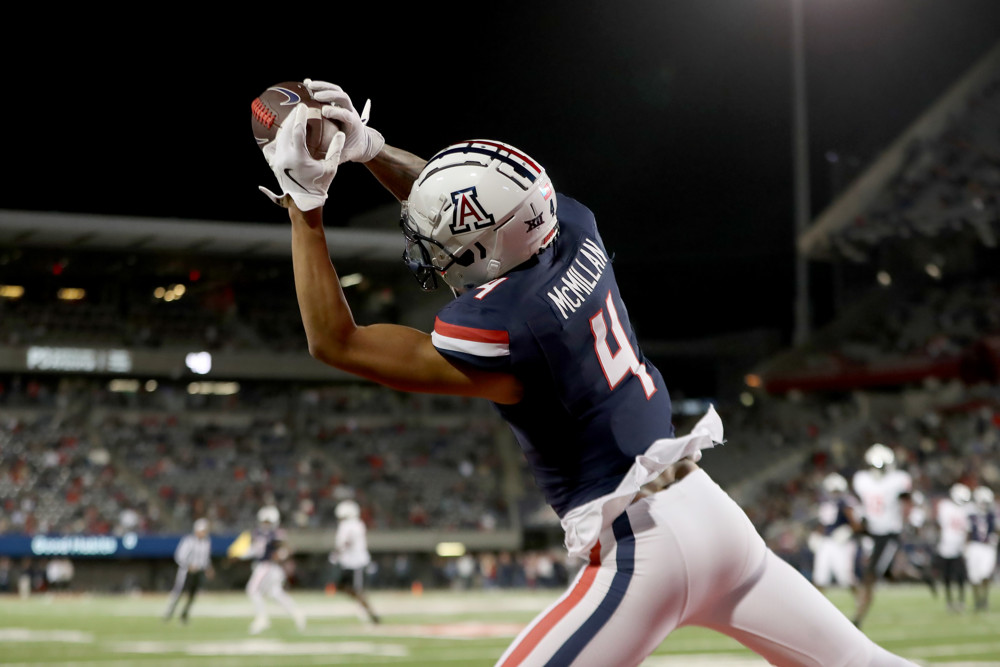TUCSON, AZ - NOVEMBER 15: Arizona Wildcats wide receiver Tetairoa McMillan #4 catches the ball but is unable to remain in bounds during a football game between the University of Houston Cougars and the University of Arizona Wildcats. November 15, 2024 at Arizona Stadium in Tucson, AZ. (Photo by Christopher Hook/Icon Sportswire)