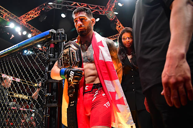 Ilia Topuria celebrates his championship victory against Alexander Volkanovski during UFC 298 at Honda Center.