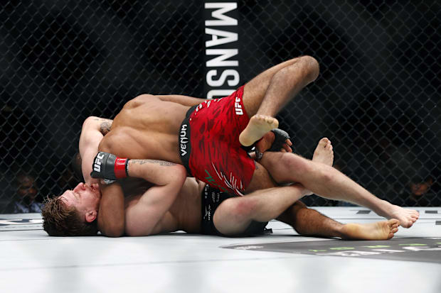 Jack Shore fights Youssef Zalal in a featherweight bout during UFC Fight Night at Rogers Place.