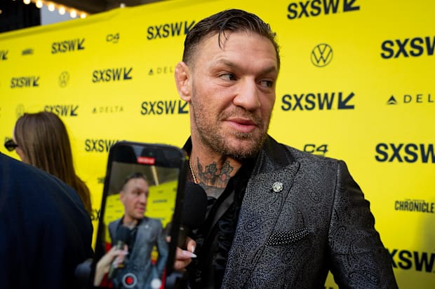 Conor McGregor speaks to press on the red carpet before the premiere of Roadhouse at the Paramount Theatre in Austin, Texas.