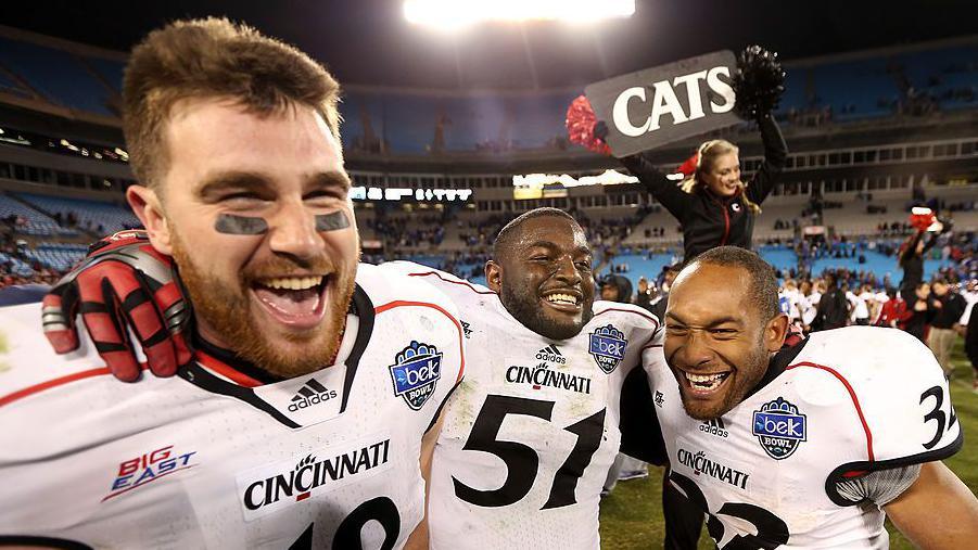 Travis Kelce celebrating with Cincinnati team-mates in December 2012