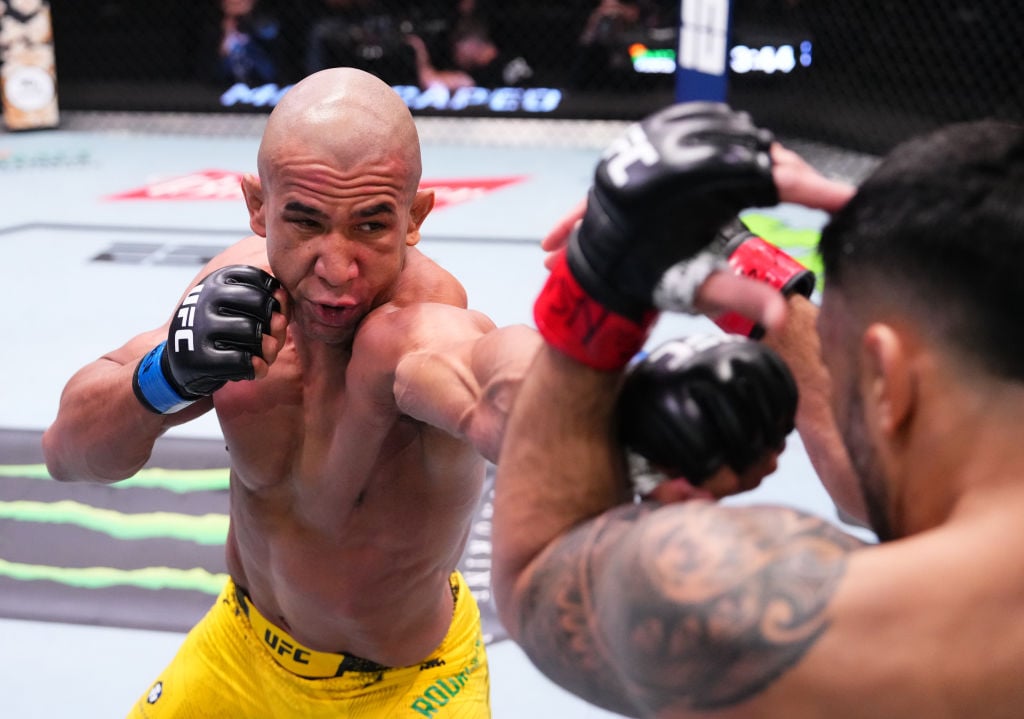 (L-R) Gregory Rodrigues of Brazil punches Brad Tavares in a middleweight fight during the UFC Fight Night event at UFC APEX on February 10, 2024 in...