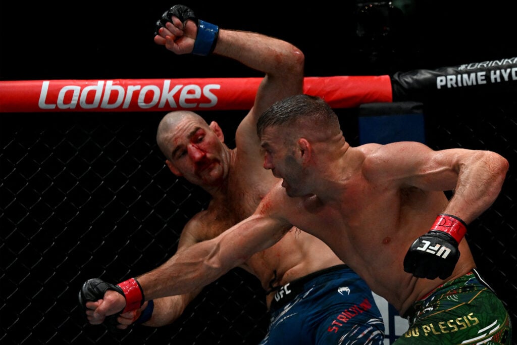 South Africa's Dricus du Plessis (R) fights Sean Strickland of the US during their men's middleweight division event of the Ultimate Fighting Champ...