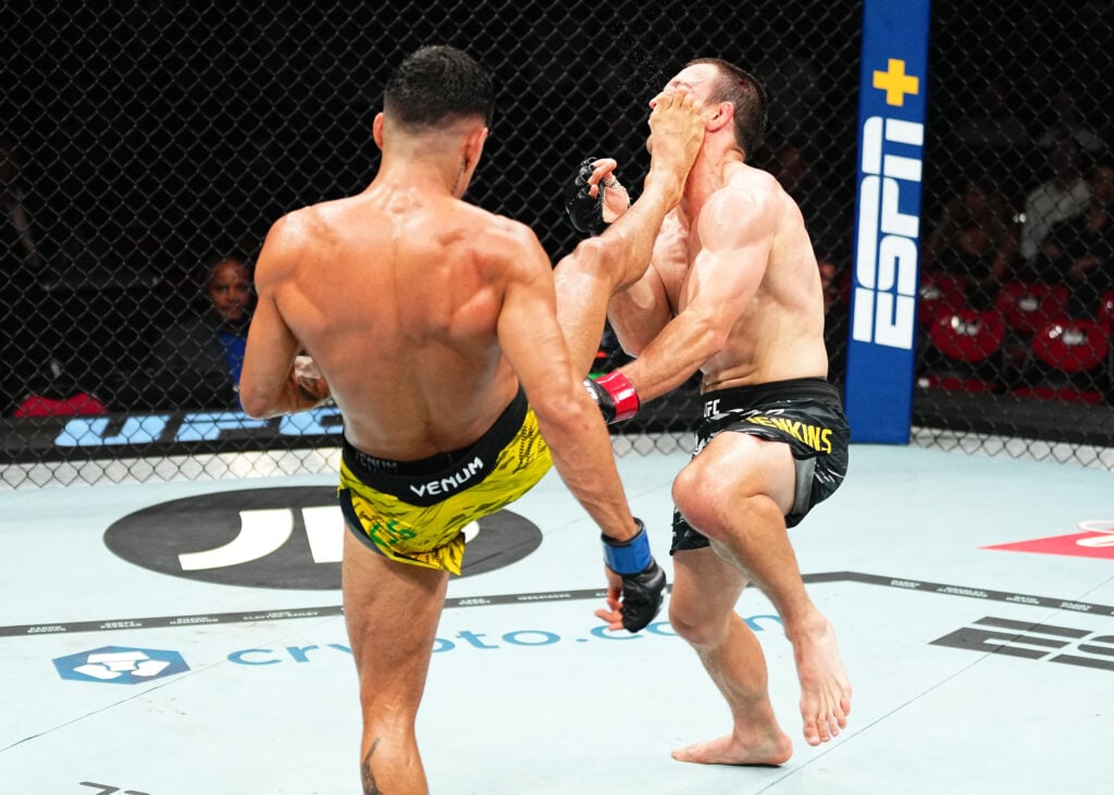 (L-R) Gabriel Santos of Brazil kicks Jack Jenkins of Australia in a featherweight fight during the UFC 312 event at Qudos Bank Arena on February 09...