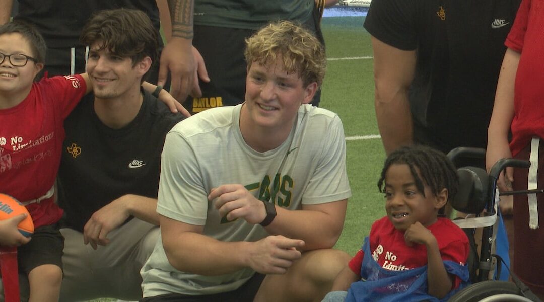 ‘I feel like I’m in the NFL’: Kids with disabilities play football with Baylor football players