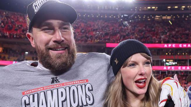 Travis Kelce and Taylor Swift smiling after the Kansas City Chiefs beat the Buffalo Bills in January 2025