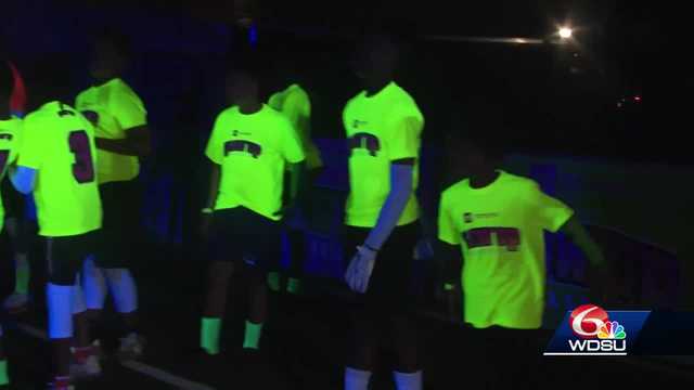 NFL Stars Play Flag Football with kids at newly lit field